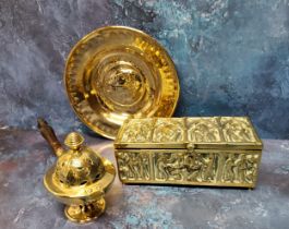 An 18th century brass circular alms dish, in the Nuremberg manner, embossed with Marcus Tullius