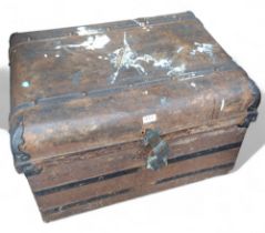A substantial early 20th century tin trunk, 50cm high, 74cm wide