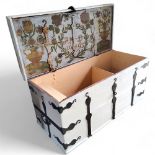 A substantial 17th century Swedish chest, overpainted in white and black, the hinged cover revealing
