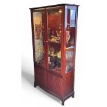 A Stag glazed display cabinet, 180cm high, 90cm wide