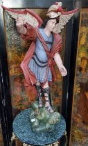 A large 17th century style Spanish  polychrome carving, Saint Michael The Archangel slaying the