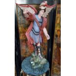 A large 17th century style Spanish  polychrome carving, Saint Michael The Archangel slaying the