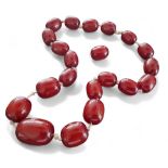 A cherry amber bead necklace + one spare bead, gross weight approx 214g gross, largest bead measures