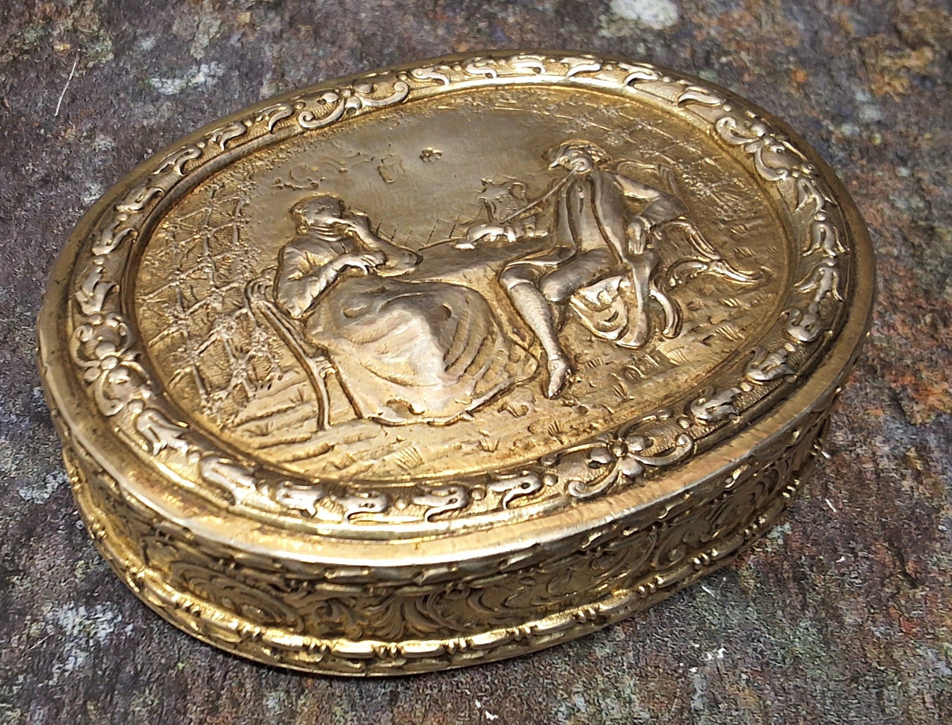 A good Dutch silver oval table snuff box, the cover embossed with figures at a table, harebell - Image 2 of 4