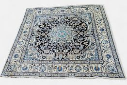 A large Persian Nain Kashmar rug, vivid tones of dark blue, white and turquoise, 195cm x 195cm
