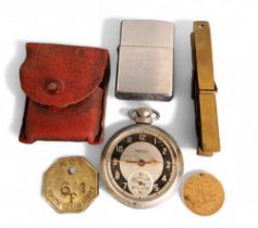 A National Coal Board Pit token, Wath Main Unit 6F1;  a Zippo lighter;  an Ingersoll Triumph