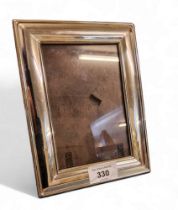 A silver rectangular easel photograph frame, 19.5cm high, Sheffield 1998