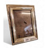 A silver rectangular easel photograph frame, 19.5cm high, Sheffield 1998