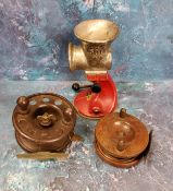 A Modernite Pixie Bakelite fishing reel, 10cm diam;  a mahogany fishing reel, 8.5cm;  a Spong & Co