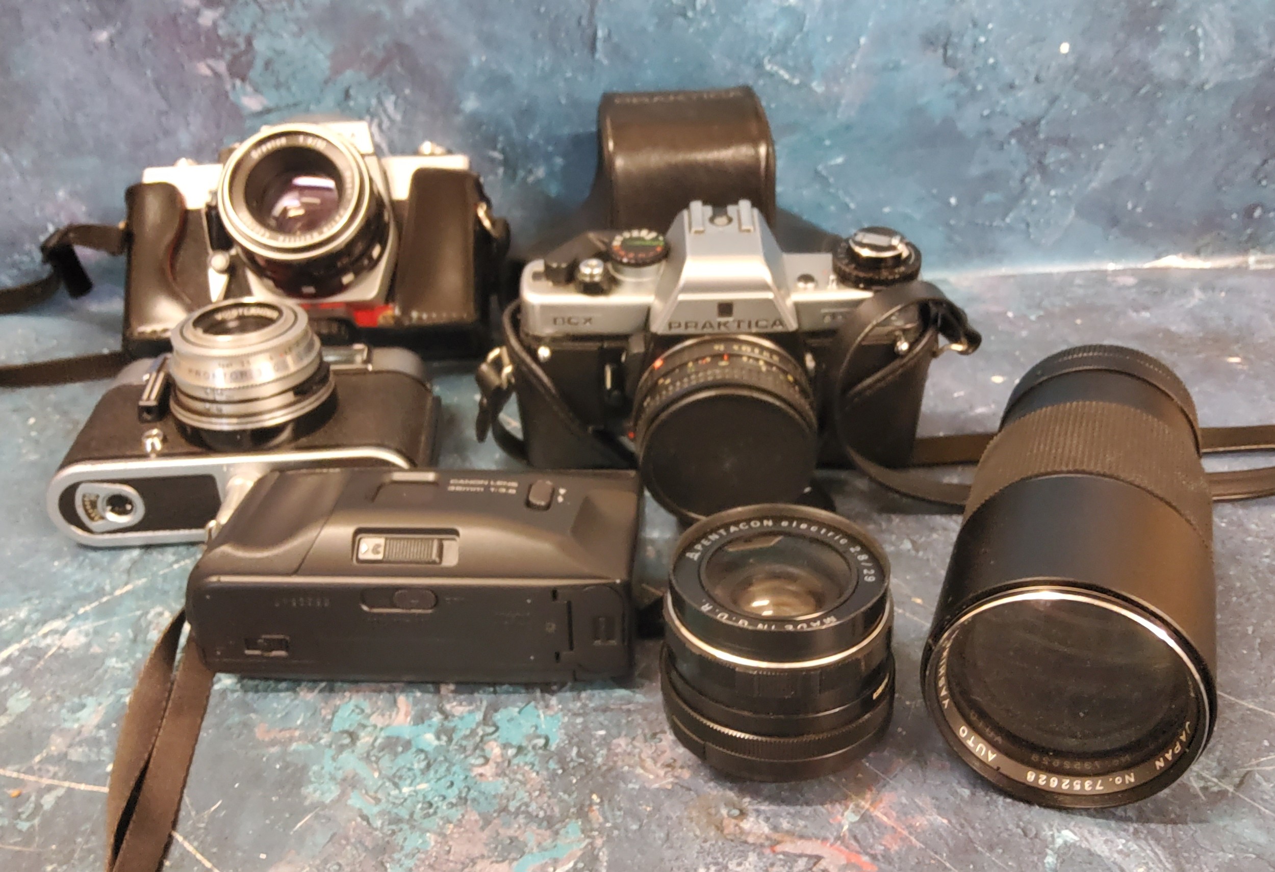 Cameras - Praktica LLC SLR 35mm;  Praktica BCX SLR 35mm;  Voiglander Vitoret DR;  Yashikor 200mm 1: