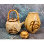 A Studio Pottery teapot, in the Cornish manner, bamboo handle, 30cm high, seal mark;  a similar