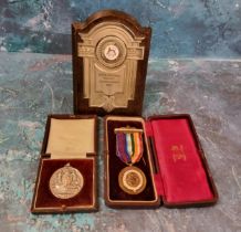 A City of Sheffield Education Committee medal, awarded to Winnie Shaw for 8 years Punctual