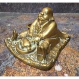 A 19th century brass novelty inkwell, cast as a portly gentleman, seated, 15cm wide, c.1860