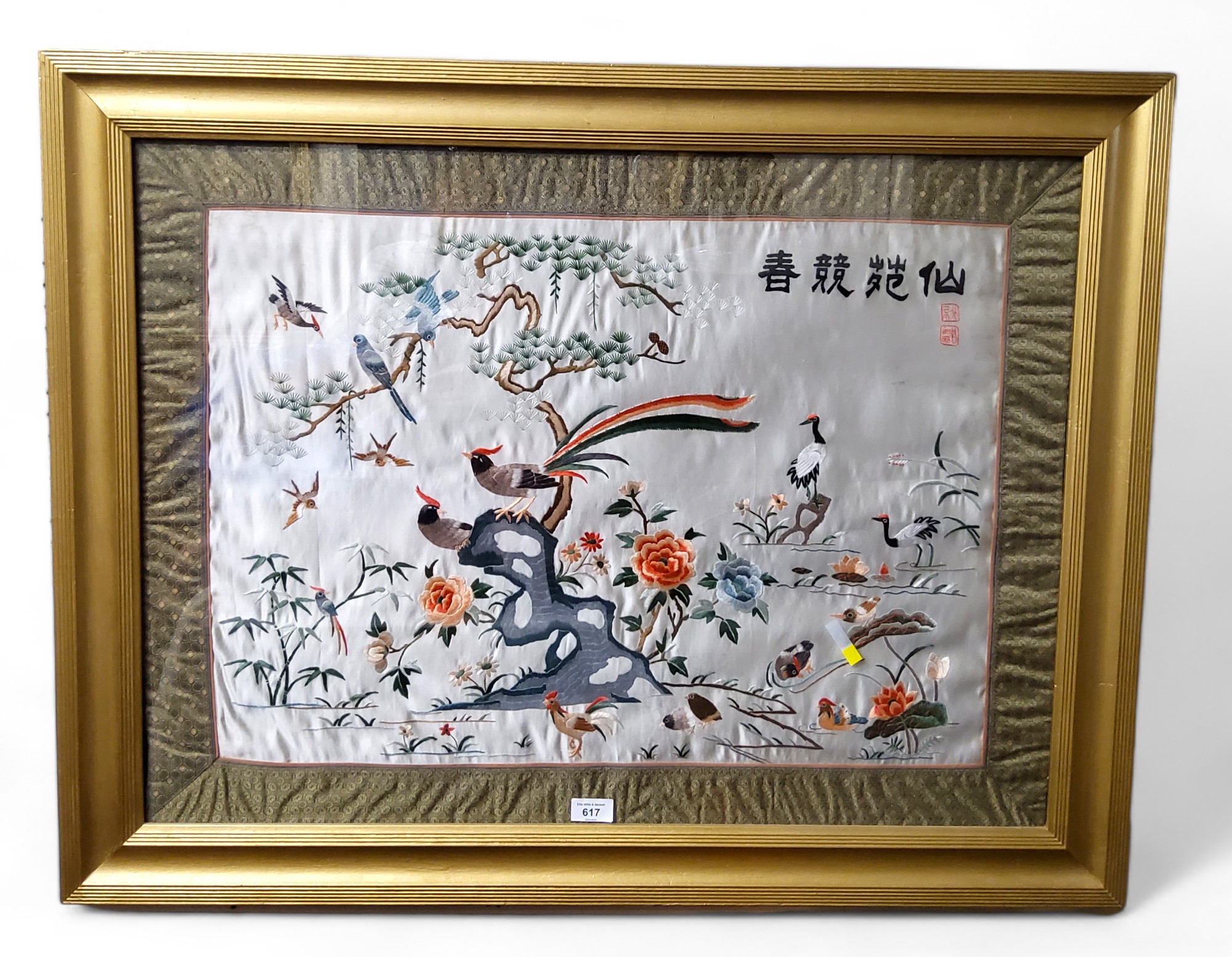 Chinese School, a large silk picture, embroidered with exotic birds, peonies and pine trees with
