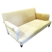 A contemporary sofa, light mustard upholstery, mahogany legs, 173cm wide