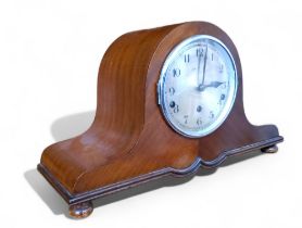 An early 20th century mahogany Napoleonic hat mantel clock, Arabic numerals, three winding holes,