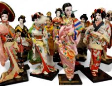 A Japanese Geisha, standing, black rectangular base;  others, various poses