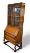 An early 20th century oak bureau display cabinet, 205cm high, 89cm wide, c.1930