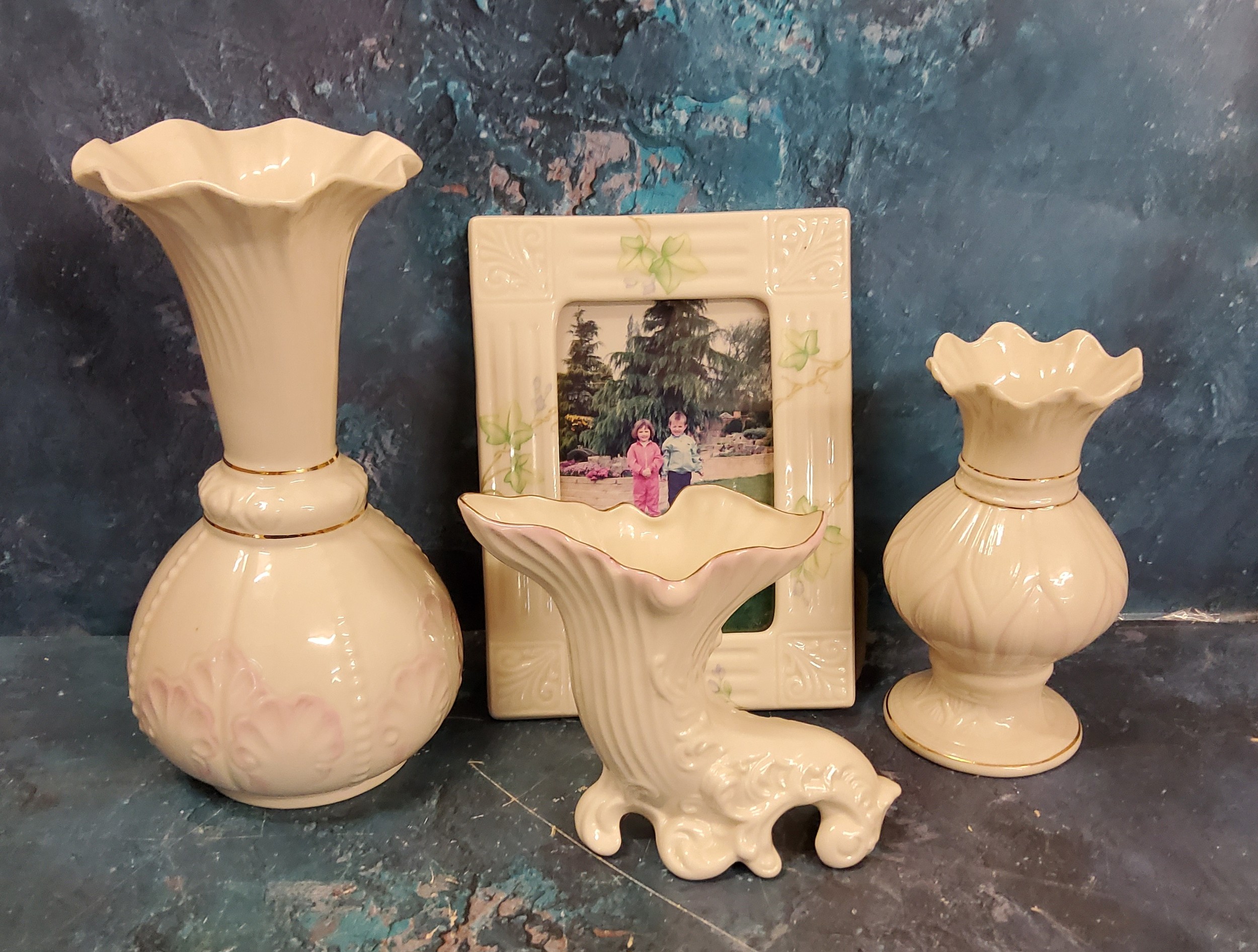 A Belleek Lotus Blossom spill vase, 16cm high, blue mark;  a Belleek Rossmore vase, 23.5cm high;