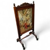 A Victorian mahogany and rosewood tapestry fireside screen, scroll legs, 106cm high, 52cm wide, c.