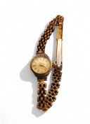 A 9ct gold Excalibur lady's wristwatch, Swiss 17 Jewel Incabloc movement, white dial, gold baton