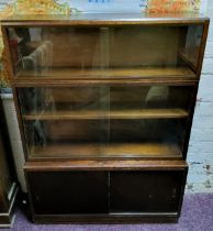 An early 20th century dark mahogany Globe Wernicke type stacking bookcase cabinet of sectional