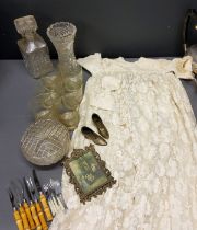 An early 20th century white lace and taffata dress, c.1930;  cut glass;  flatware;  etc