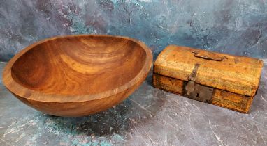 A turned wooden bowl, 29cm diam;   a domed tooled leather box, iron swing handle and lock, 20cm
