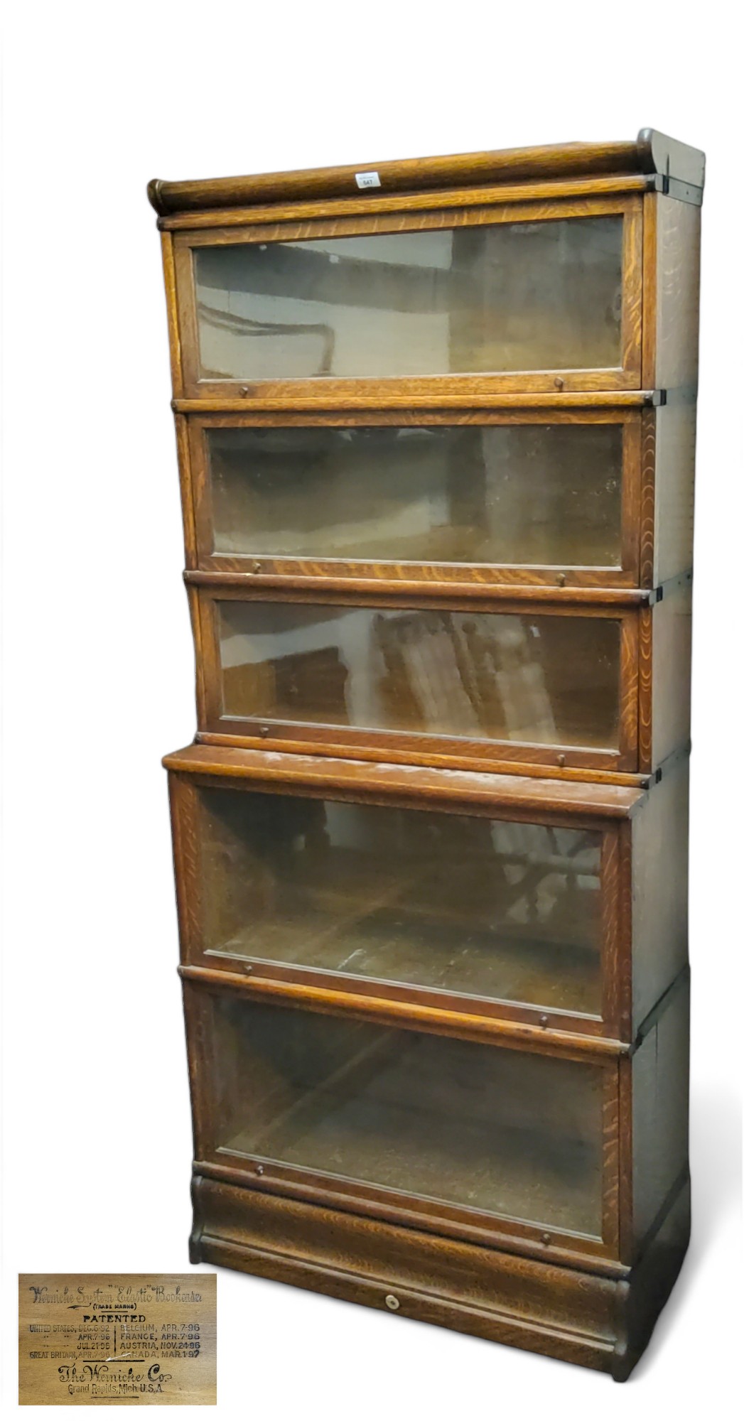 A late 19th century oak Wernicke System 'elastic' bookcase, stamped five section Globe Wernicke