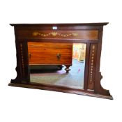 An early 20th century mahogany overmantel mirror, decorated with roundels and swags, 68cm high,