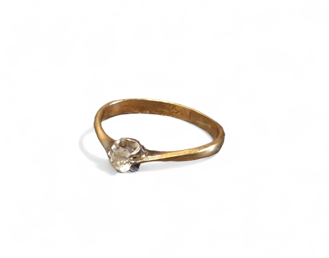 A 14ct gold diamond solitaire ring, the round diamond approx. 12pts, size N, 1.88g