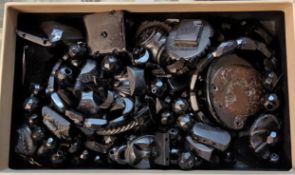 Various Whitby Jet fragments including bracelet links, beads, some carved, etc.