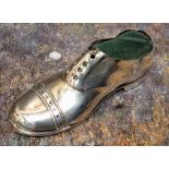 A George V silver novelty pin cushion, as a shoe, 12.5cm wide, Chester 1912