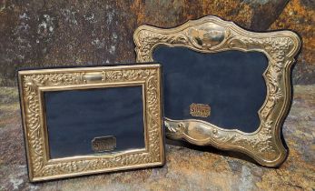 A Victorian style silver shaped rectangular easel photograph frame, embossed with flowers, 14cm x