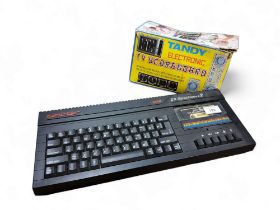 Sinclair 128k ZX Spectrum+2, (crack to cassette plastic);  Tandy Electronic TV Scoreboard , in