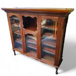 A late Victorian mahogany library display cabinet with glazed and open shelves, 147cm high, 165cm