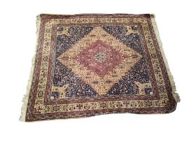 A large 20th century woollen rug / carpet, terracotta ground with geometric pattern, 232cm x 203cm