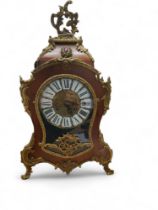 A French maple and gilt metal mounted cartouche shaped mantel clock, Roman numerals, 57cm high
