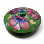 A Moorcroft  Anemone  bowl and cover, tube lined with large flower heads, on a green ground, 12cm