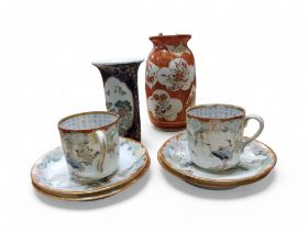 A Japanese Kutani vase, 15.5cm high, Meiji period;   two Japanese eggshell coffee cups, the interior