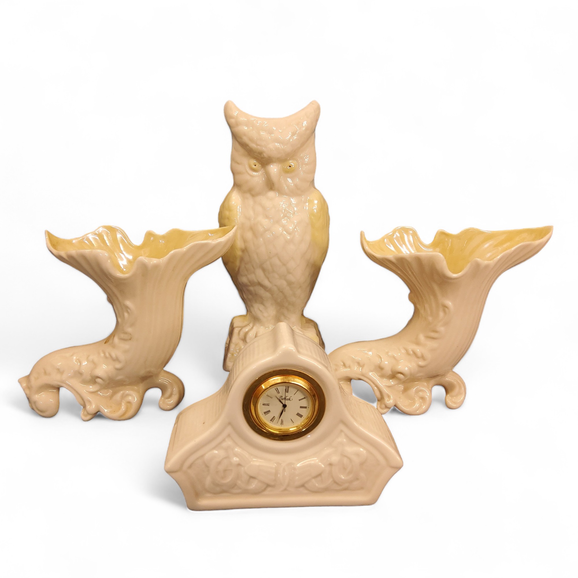 A Belleek Owl vase, lustrous yellow wings, 21.5cm high, green mark;  a pair of similar cornucopia