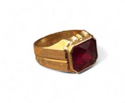 A 14ct gold gentleman's signet ring, set with an emerald cut red stone approx. 9 x 11.3mm, size R,