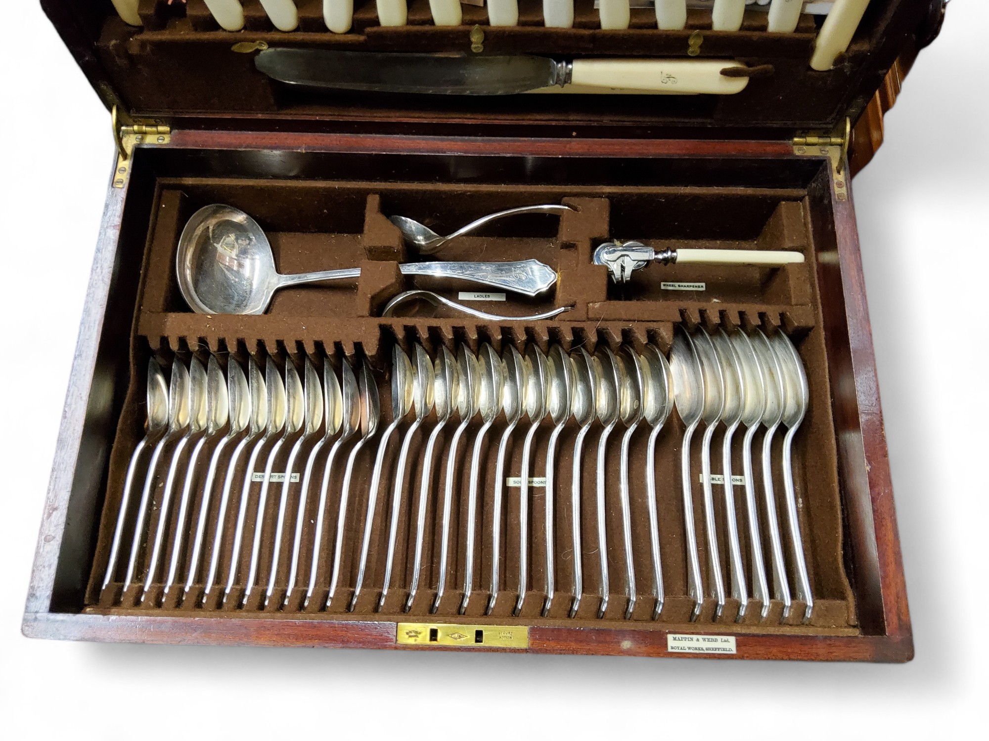 A canteen of Mappin and Webb flatware, comprising soup spoons,  table knives, forks and spoons,