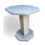 A "marble" octagonal garden table, square support, octagonal base, 45cm high