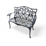 A contemporary Art Nouveau style aluminium garden two seater bench.