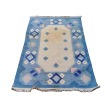 A Swedish flat weave carpet, signed by Svensk Hemslöjd “SH” in pastel tones, 138cm wide x 200cm