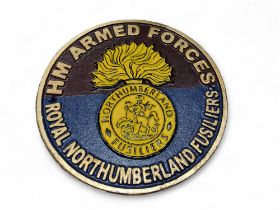 A cast iron commemorative plaque, HM Armed Forces Royal Northumberland Fusiliers,  23.5cm diam