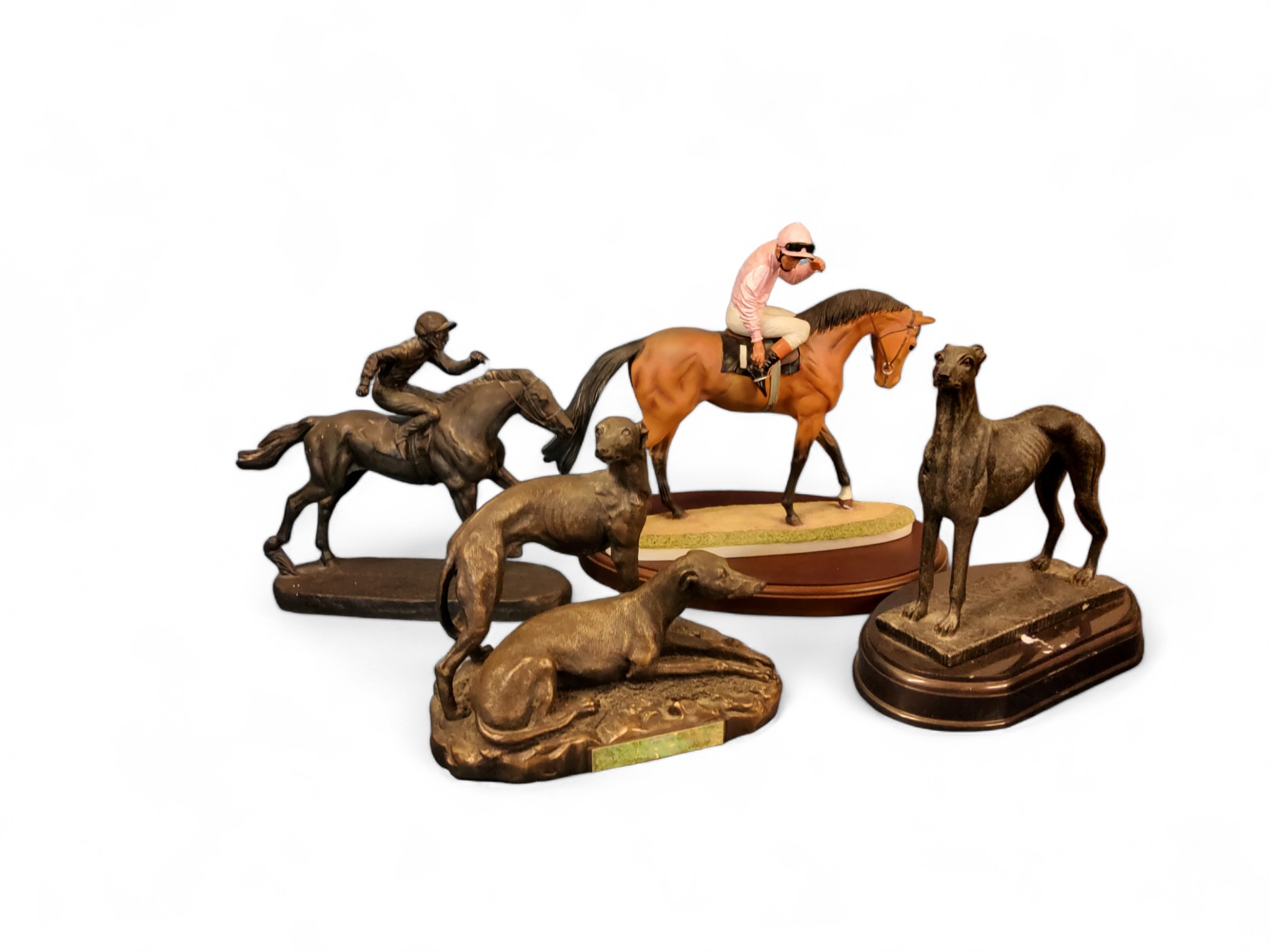 A resin bronzed figure, of a greyhound, oval base, 23cm high;  another, greyhound pair, 19cm