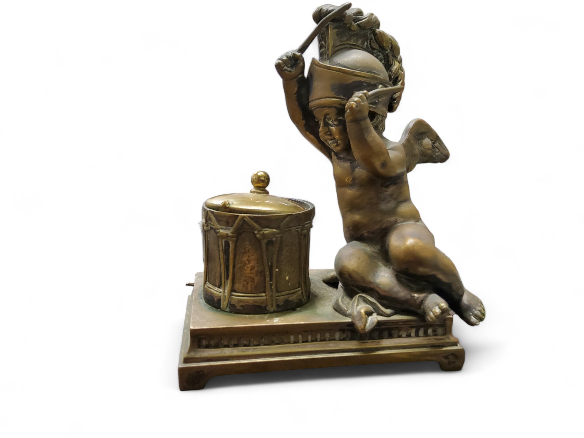 A 19th century bronze novelty inkwell, cast as a putti beating a drum, 15cm high, c.1860