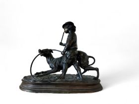 After Jules Moigniez, a dark patinated bronze, boy with a greyhound and hoop, oval base, 26cm high